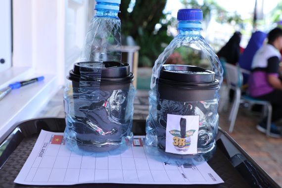Repurposed plastic bottles turned into coffee cup carriers at the SMARTER Brunei Cafe & Bistro. Photo: Rasidah HAB/The Scoop