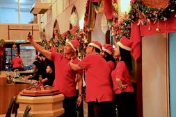 Church-goers dressed in Santa hats celebrate attend a Christmas Eve service at St Andrew's Anglican Church in Bandar Seri Begawan. Photo: Wardi Wasil/The Scoop