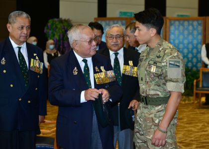 HRH Prince 'Abdul Mateen speaks with retired military personnel. Photo: Infofo