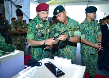 HRH Prince Haji Al-Muhtadee Billah view an exhibit as part of the RBAF's Diamond Jubilee celebrations. Photo: Infofoto